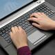 Woman Using a Laptop Computer... (thumbnail)