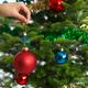 Woman Decorating a Christmas Tree... (thumbnail)