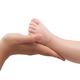 Mother Holding Baby's Foot in Her Hands... (thumbnail)