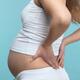 Pregnant Woman Rubbing Her Back... (thumbnail)