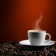 Steaming Cup of Coffe Latte on Coffee Beans... (thumbnail)