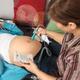 Midwife Listening to a Pregnant Woman's Baby Heartbeat... (thumbnail)