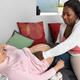 Midwife Measuring Pregnant Woman's Fundal Height... (thumbnail)