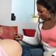 Midwife Checking Pregnant Woman Baby's Heartbeat... (thumbnail)
