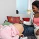 Midwife Checking Pregnant Woman Baby's Heartbeat... (thumbnail)