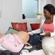 Midwife Monitoring a Pregnant Woman's Baby Heartbeat... (thumbnail)