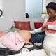 Midwife Monitoring a Pregnant Woman's Baby Heartbeat... (thumbnail)