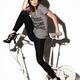 Young Woman On Exercise Bike... (thumbnail)