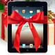 iPad with a Gift Bow under a Christmas Tree... (thumbnail)