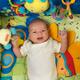 Baby Boy Lying on a Play Mat... (thumbnail)