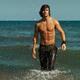 Young Man Walking Out of the Water... (thumbnail)