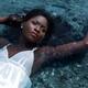 Young Woman in White Dress Lying in Water... (thumbnail)