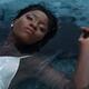 Young Woman in White Dress Lying in Water... (thumbnail)