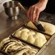 Baker Glazing Bread... (thumbnail)