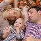 Happy Smiling Family Lying on Fallen Autumn Leaves... (thumbnail)