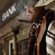 Cowboy Smoking a Cigar Outside of a Bank Building Notorious villain in... (thumbnail)