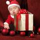 Baby Boy in Santas Costume Sleeping with a Present... (thumbnail)