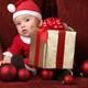Baby Boy in Santa Costume with a Christmas Present... (thumbnail)