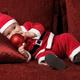 Baby Boy in Santas Costume with a Christmas Bauble... (thumbnail)