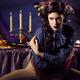 Beautiful Woman Sitting at a Festive Table... (thumbnail)