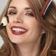 Smiling Young Woman with Her Hair and Makeup Being Done... (thumbnail)