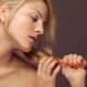 Beautiful Young Woman with Orange Nail Polish... (thumbnail)