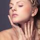Beautiful young woman touching her face with natural light makeup... (thumbnail)