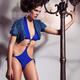 Young Woman in Blue Swimsuit and Fur Vest... (thumbnail)