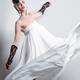 Beautiful Woman with a Creative Hairstyle Wearing a Long White Dress... (thumbnail)