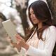 Young Woman Outdoors with a Tablet Computer... (thumbnail)