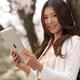 Young Woman Outdoors with iPad... (thumbnail)