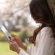 Young Woman Outdoors with iPad... (thumbnail)