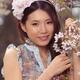 Portrait of a Young Smiling Woman Standing at a Cherry Tree... (thumbnail)