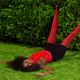 Young Woman in Fancy Bright Clothes Lying on the Grass... (thumbnail)