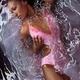 Woman in Swimsuit Lying in Water... (thumbnail)