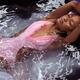 Woman in Swimsuit Lying in Water... (thumbnail)