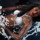Beautiful Woman in Swimsuit Lying in Water... (thumbnail)