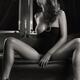Beautiful Half Naked Woman Sitting on a Bed... (thumbnail)