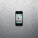 Apple iPhone 4 Smartphone on Wet Metal... (thumbnail)