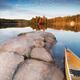 Canoe at a Rocky Shore Autumn Nature Scenery... (thumbnail)