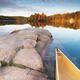 Canoe at a Rocky Shore Autumn Nature Scenery... (thumbnail)