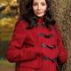 Woman in a Red Coat Leaning Against a Tree... (thumbnail)