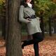 Woman Leaning Against a Tree in Autumn Park... (thumbnail)