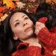 Beautiful Woman Lying on Fallen Leaves... (thumbnail)