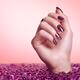 Woman Hand With Purple Nail Polish... (thumbnail)