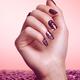 Woman Hand With Purple Nail Polish... (thumbnail)