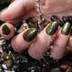 Woman Hand With Fancy Nail Polish in Water... (thumbnail)