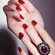 Woman hands with red nail polish and a ring... (thumbnail)