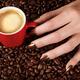 Woman Hand Holding a Cup of Latte... (thumbnail)