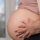 Closeup of man and woman's hands on pregnant belly... (thumbnail)